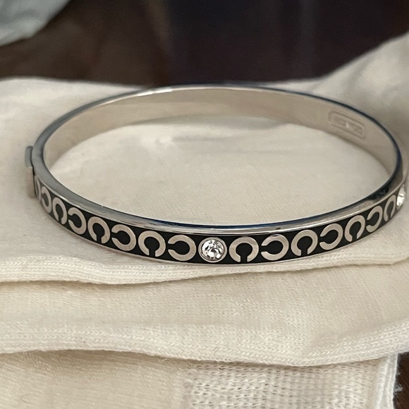 Coach Jewelry - Coach bangle bracelet.  Slide over hand style.  Excellent pre owned condition.